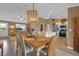 Open dining area featuring natural light, comfortable seating, and a seamless connection to the kitchen at 1755 Lakewood Dr, The Villages, FL 32162