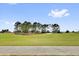 Scenic view of the lush green golf course and meticulously maintained landscaping at 1755 Lakewood Dr, The Villages, FL 32162