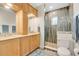 Modern bathroom with double vanities, a glass-enclosed shower, and contemporary finishes, providing a clean and stylish space at 17561 Seidner Rd, Winter Garden, FL 34787