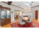 Inviting dining room with elegant wood flooring and modern furnishings, perfect for entertaining and Gathering meals at 17561 Seidner Rd, Winter Garden, FL 34787