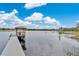 View of private dock on the lake with gazebo and relaxing spot at 17561 Seidner Rd, Winter Garden, FL 34787