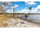 Lakefront property with a private dock, a gazebo, and lush green surroundings at 17561 Seidner Rd, Winter Garden, FL 34787