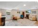 Cozy living room with neutral colors, tile flooring, and a door that leads to the backyard at 17561 Seidner Rd, Winter Garden, FL 34787