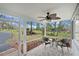 Screened porch with two chairs and a table overlooking the yard at 17561 Seidner Rd, Winter Garden, FL 34787