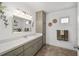 Well-lit bathroom featuring a stylish vanity with good storage and decorative accents at 17834 Se 105Th Ave, Summerfield, FL 34491