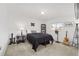 Airy bedroom featuring minimal decor and a large window at 17834 Se 105Th Ave, Summerfield, FL 34491