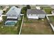 Aerial view of a backyard with a screened-in pool and a covered patio, providing ample space for outdoor entertaining at 1787 Sunset Ridge Dr, Mascotte, FL 34753