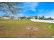 Lush backyard featuring expansive lawn area and full privacy fencing at 1787 Sunset Ridge Dr, Mascotte, FL 34753