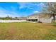 Wide shot of a expansive backyard surrounded by privacy fencing at 1787 Sunset Ridge Dr, Mascotte, FL 34753