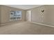 Neutral bedroom with carpet flooring and natural light at 1787 Sunset Ridge Dr, Mascotte, FL 34753