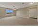 Empty bonus room with neutral carpet, fixtures, and natural light at 1787 Sunset Ridge Dr, Mascotte, FL 34753