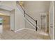 Inviting foyer with high ceilings, tile flooring, and a staircase at 1787 Sunset Ridge Dr, Mascotte, FL 34753