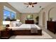 Staged main bedroom features a large window and plenty of storage space at 1787 Sunset Ridge Dr, Mascotte, FL 34753