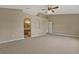 Spacious carpeted main bedroom with ensuite bathroom access at 1787 Sunset Ridge Dr, Mascotte, FL 34753