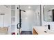 Modern bathroom featuring a glass enclosed shower with rainfall shower head, white tile, and built-in shelving at 1930 Hilltop Dr, Mount Dora, FL 32757