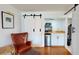 Sitting area featuring hardwood floors and a kitchenette with a mini-refrigerator at 1930 Hilltop Dr, Mount Dora, FL 32757