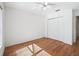 Light-filled bedroom features a ceiling fan, hardwood floors and closet at 203 Del Rio Drive, Lady Lake, FL 32159