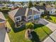 Aerial view of the property with lush landscaping and mature trees at 2175 Madero Dr, The Villages, FL 32159