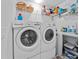 Bright laundry room featuring an LG washer and dryer set and ample storage shelving for organization at 2175 Madero Dr, The Villages, FL 32159