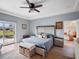 Relaxing main bedroom with a view of the water and sliding glass doors to backyard at 21849 Tartan St, Leesburg, FL 34748