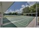 Exterior view of multiple shuffleboard courts, each clearly marked and ready for play, in a sunny setting at 21849 Tartan St, Leesburg, FL 34748