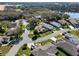 Property aerial showing prime location with a home featuring solar panels, lush greenery and established neighborhood at 21850 Tartan St, Leesburg, FL 34748