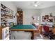 Craft room with natural light, a ceiling fan, a large table, and storage shelves at 21850 Tartan St, Leesburg, FL 34748