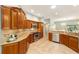 Kitchen featuring stainless appliances, granite counters, and ample cabinet space at 2279 Lowell Ter, The Villages, FL 32162