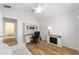 View of the office with wood laminate floors and built-in desk and shelving at 2279 Lowell Ter, The Villages, FL 32162