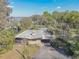 Aerial view of the home with a covered carport and waterfront views at 2439 Cr 453, Lake Panasoffkee, FL 33538