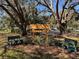 Sign for The Plantation at Leesburg Golf Courses, Restaurant & Pro Shop surrounded by greenery at 25124 Twelve Oaks Rd, Leesburg, FL 34748