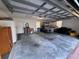 Spacious garage with ample space for a golf cart and other storage needs at 25124 Twelve Oaks Rd, Leesburg, FL 34748