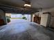 Spacious garage with ample storage, washer-dryer hookups, and a convenient utility sink at 25124 Twelve Oaks Rd, Leesburg, FL 34748