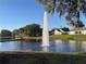 Scenic pond view with fountain and gazebo, creating a serene and picturesque setting for residents to enjoy at 25124 Twelve Oaks Rd, Leesburg, FL 34748