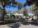 Exterior of the Plantation Oaks Restaurant with a well-manicured landscape on a sunny day at 25124 Twelve Oaks Rd, Leesburg, FL 34748