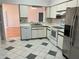 Kitchen area featuring white cabinets, modern appliances, and an open layout at 25212 Clifford Hl, Leesburg, FL 34748