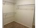 Functional walk-in closet with ample shelving and hanging space for storage at 25212 Clifford Hl, Leesburg, FL 34748