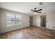 Cozy bedroom featuring hardwood floors and a window at 2541 Privada Dr, The Villages, FL 32162