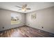 Bedroom with neutral paint, a ceiling fan, and two windows at 2541 Privada Dr, The Villages, FL 32162