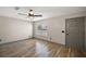 Cozy bedroom featuring hardwood floors and a window at 2541 Privada Dr, The Villages, FL 32162