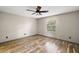 Light-filled bedroom with a window and wood-look flooring at 2541 Privada Dr, The Villages, FL 32162