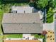 This aerial view highlights the home's roof and the well-maintained yard and patio at 2667 Collington Dr, The Villages, FL 32162