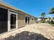 Charming patio with stylish pavers and a retractable awning for shaded outdoor enjoyment at 2667 Collington Dr, The Villages, FL 32162