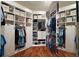 Walk-in closet with custom shelving and storage solutions, providing ample space at 2882 Adrienne Way, The Villages, FL 32163