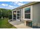 View of the back of the home, showing the back patio and small backyard at 2882 Adrienne Way, The Villages, FL 32163