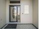 Close-up of the elegant front door with decorative glass and sidelight, showcasing the entrance detail at 2882 Adrienne Way, The Villages, FL 32163