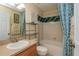 Cozy bathroom with a shower-tub combo and modern fixtures at 303 White Water Bay Dr, Groveland, FL 34736