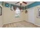 Cozy bedroom featuring carpet, neutral walls, closet, and window with decorative curtains at 303 White Water Bay Dr, Groveland, FL 34736