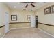 Bedroom with ceiling fan, large closet, and doorway to bathroom at 303 White Water Bay Dr, Groveland, FL 34736