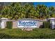 Well-maintained entrance sign for Waterside Pointe community surrounded by lush landscaping at 303 White Water Bay Dr, Groveland, FL 34736